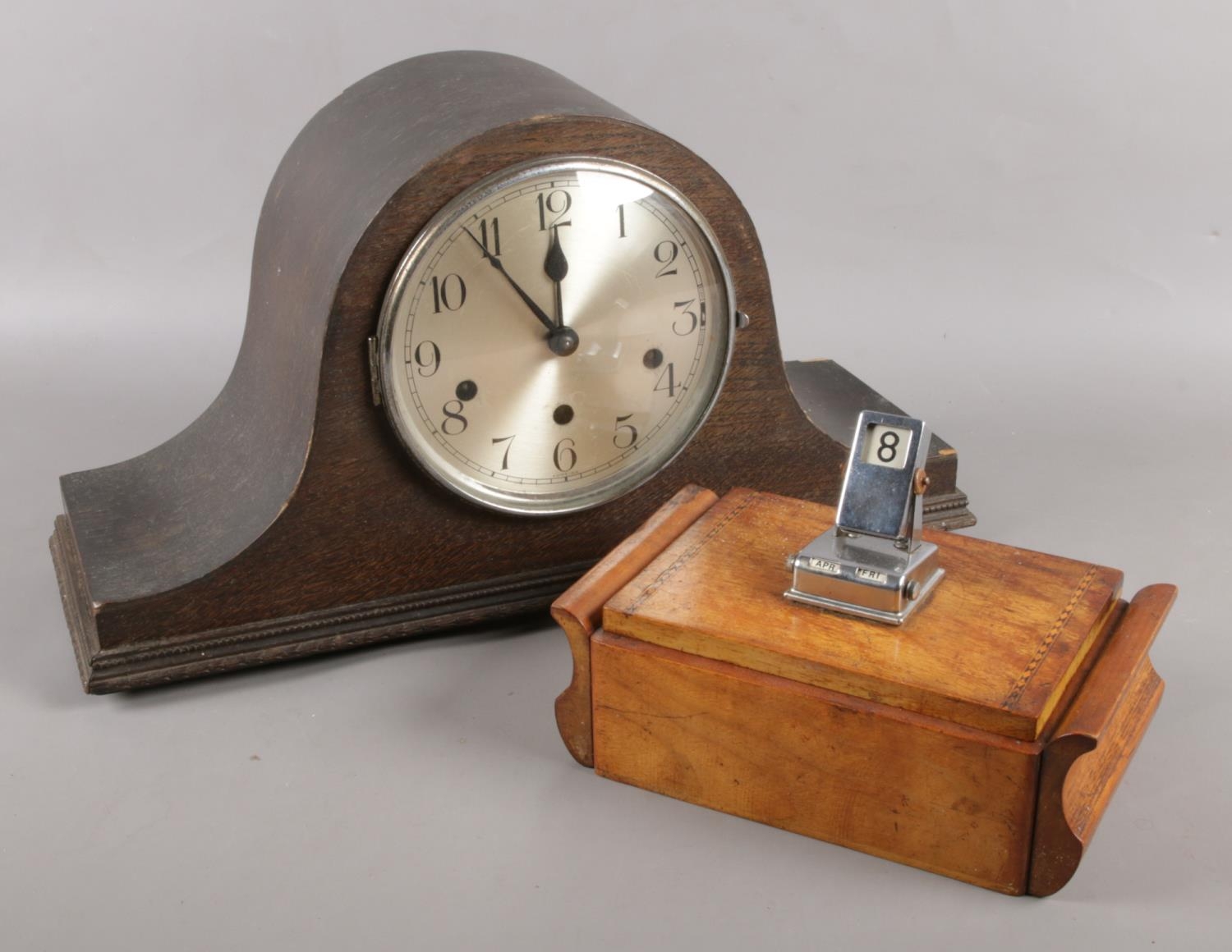 A Haller Westminster chime mantel clock, along with a vintage cigarette dispenser with calendar.