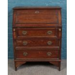 A small oak bureau. Height 96.5cm, Width 76cm, Depth 38cm.