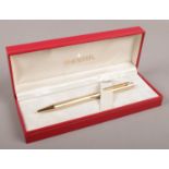 A boxed Sheaffer 70 gold plated pen.