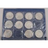 An album of replica crowns and modern coins. To include an album of replica crown side coins from