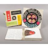 A Beatles Song book and a magnetic tape of a recording of songs from 'The Beatles for Sale' Album.