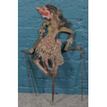 A Vintage Wayang Kulit Indonesian shadow puppet. Marked 'Darsasana'. 81cm length.