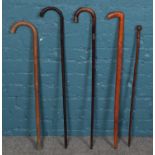 Five walking sticks. Including silver collared example, etc.