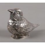 A white metal pepperette modelled as a bird. Stamped 925.