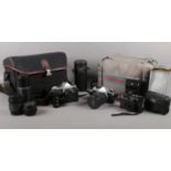 A collection of vintage photography equipment. Two Pentax ME super camera, Pentax zoom 80mm -200mm