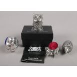 Four white metal/pewter novelty pin cushions. One boxed by AE Williams.