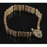 A 9ct Gold bracelet, with 9ct Gold heart shaped padlock. Total weight: 6.60g