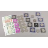 A collection of bank notes, including ten shilling and one pound examples, together with a number of