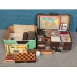 A large quantity of vintage games, some contained within a 'Revelation' suitcase. To include