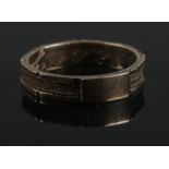 A Victorian yellow metal mourning ring. Inscribed to inside of shank, and dated 1865. Size N 1.