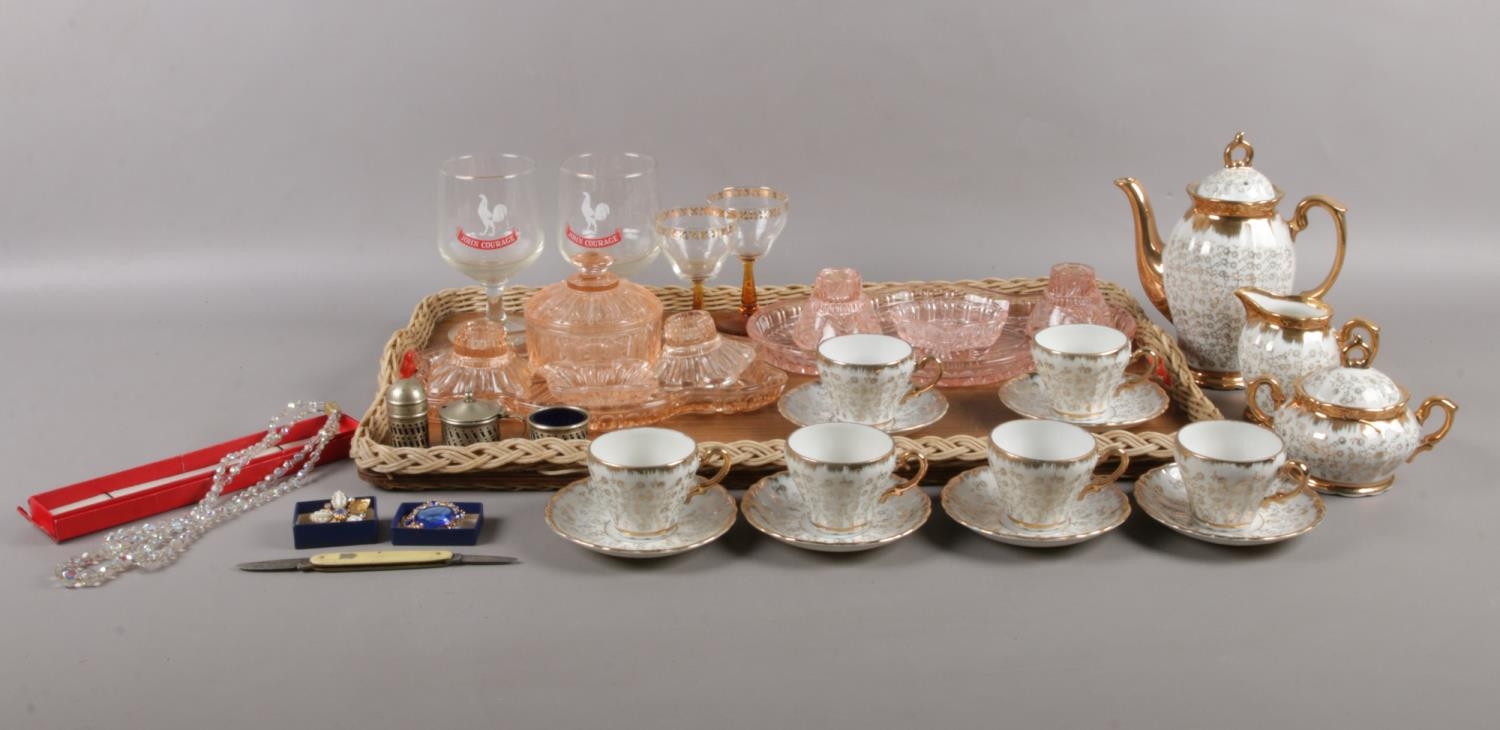A tray of miscellaneous. To include two pink glass dressing table sets, a gilt and white coffee