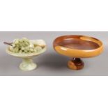 An onyx fruit bowl and fruit together with a turned treen fruit bowl.