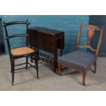 Three pieces of antique furniture. Includes small mahogany drop leaf table, inlaid nursing chair and