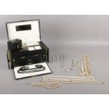 A large jewellery vanity case with costume jewellery contents. Comprising of a 935 silver ring,