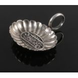 A silver caddy spoon with filigree decoration to bowl. (Tests as silver). 7.23g.