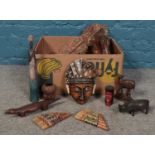 A box of assorted wood & treen. To include tribal figures, mask wall plaque, animal figures etc.
