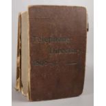 An 1898-9 telephone directory, with cut out articles of recipes and household tips on some pages.