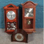 Two 31 day wall clocks along with a oak dome top mantel clock. Including Polaris, etc.