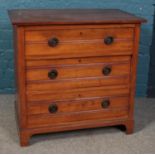 A satinwood chest of three drawers. Height: 81cm, Width: 84cm, Depth: 53cm. Staining to the top,