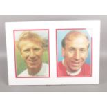 A mounted display presentation of the Charlton Brothers -(Jackie & Bobby). H:37cm W: 53.5cm. No
