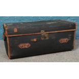 J. Andrews, Antique Painted Canvas Trunk. The top is stitched leather, with a canvas lining and