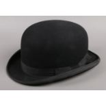 A vintage Moss Bros of Covent Garden bowler hat. Size 7 1/8.