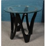 A retro style glass top table. Table top diameter 90cm.