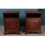 A pair of mahogany bedside cabinets. Height: 60cm, Width: 44cm.