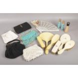 A quantity of miscellaneous. Vintage evening bags, dressing table set - mirror, brushes, Estee