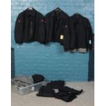 A quantity of railway uniform. Three black jackets, six black trousers (108cm waist 75cms leg),