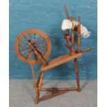 A vintage wooden spinning wheel.