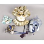 Four decorative Venetian masks, two bearing tags for La Maschera Del Galeone.