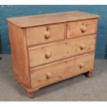 A pine chest of two over three drawers. Height 79cm Width 97cm Depth 45cm. Age wear and knocks. Some