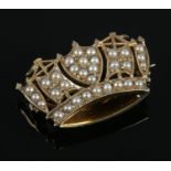 A 9ct gold and seed pearl naval crown brooch. Stamped JWB. 4.95g. 1.7cm x 2.8cm. Good condition.