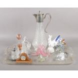 A tray of mostly assorted glassware. To include a silver plated claret jug, lead crystal rabbit, and