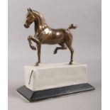 A Bronze prancing horse on a plinth. H: 16cm. Plinth has been covered in vinyl, so will need some