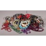 A quantity of costume jewellery. beads, bangles, necklaces etc