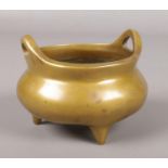 A Chinese bronzed censor/incense burner with character mark to base. 10cm x 8cm.