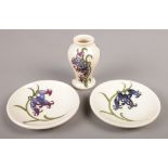 Three pieces of Moorcroft ceramics in the Bluebell design. Includes a small baluster shaped vase and