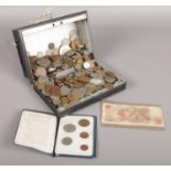 A box of British pre decimal coins. Including six pence, pennies, crowns, etc.