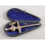 A Victorian cased champagne tap.