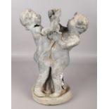 An antique garden statue pair of lead figures on base, clutching a twisted vine. Vine detached,