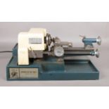 A Cowells Model 90 ME clock maker's table top centre lathe. Tested and is in working order.
