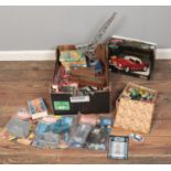 A box of toys and collectables. Including Star Wars boxed figure, diecast metal Lancia Aurelia B24