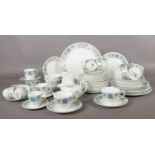 A collection of Wedgwood 'Clementine' tea & dinner ware. cups/saucers, plates, jugs, sugar bowl etc
