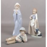 Three Nao by Lladro figures.