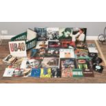 A basket of twenty three LP's and fifty four vinyl single records. To include The Stranglers,
