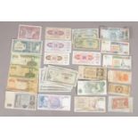 A collection of world bank notes. Includes Japanese, Greek, Malayan, Yugoslavian etc.