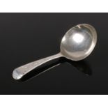 A George III silver caddy spoon. 8g.