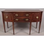 A Regency mahogany sideboard. With fan patera inlay to corners of cupboard doors and drawers. Height